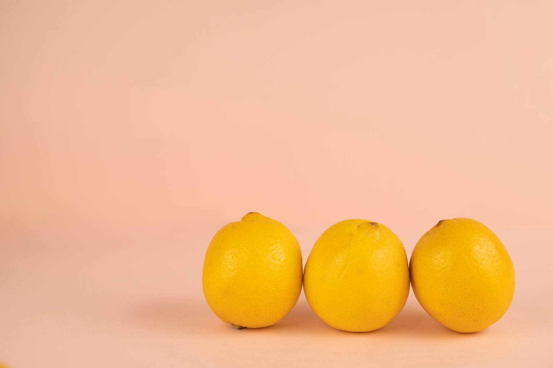 Bright ripe lemons arranged on a pastel background, symbolizing fresh approaches to solo pleasure